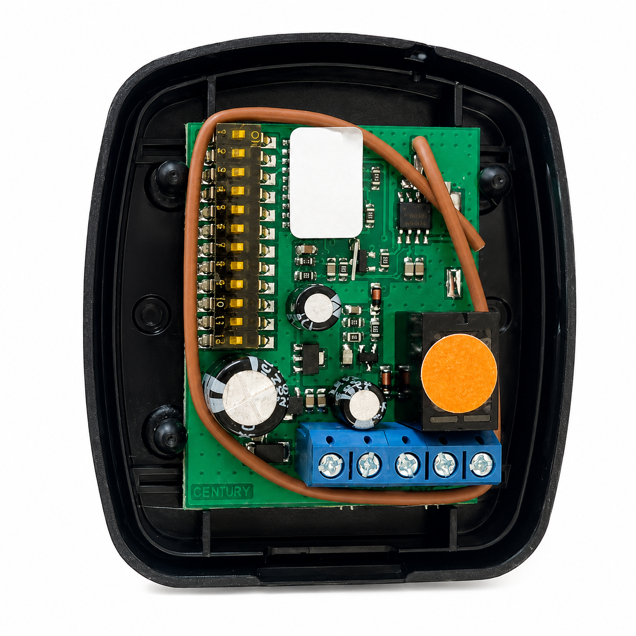 an-electronic-control-module-with-a-green-circuit-board-inside-a-black-plastic-housing-featuring-a-blue-terminal-block-a-white-sensor-and-a-prominent-orange-circular-button