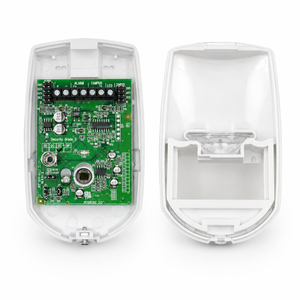 A white electronic alarm device shown open, with the front cover removed to reveal a green circuit board on the left and the empty back shell on the right, photographed on a white background.